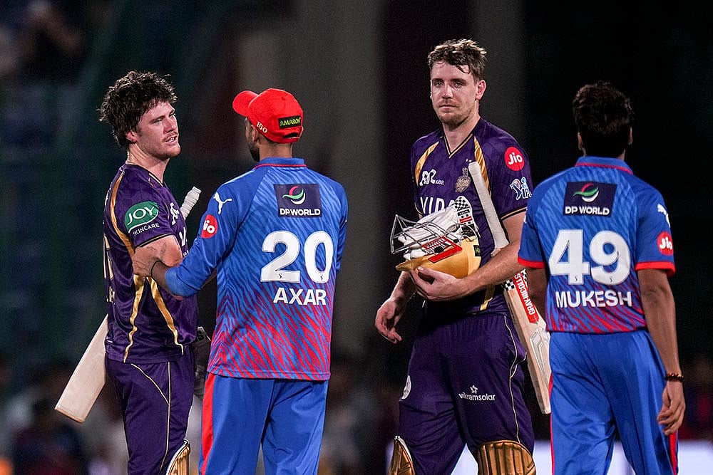 | Photo: PTI/Kamal Kishore : Kolkata Knight Riders Finn Allen, left, and Cameron Green, second right, being congratulated by Delhi Capitals captain Axar Patel, second left, and others after winning the Indian Premier League (IPL) 2026 T20 cricket match, in New Delhi,.