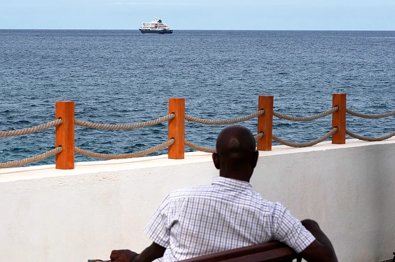 The MV Hondius cruise ship departs the port in Praia, Cape Verde, Wednesday, May 6, 2026 - Misper Apawu