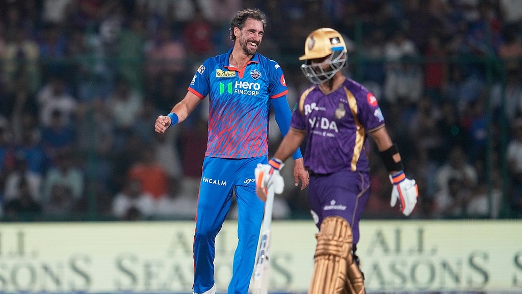 Mitchell Starc, left, reacts after getting Ajinkya Rahane, right, run out during the Indian Premier League match between Delhi Capitals and Kolkata Knight Riders in New Delhi. - Photo: AP/Manish Swarup