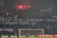 Independiente Medellin Vs Flamengo, Copa Libertadores 2026: Fan Protests Force Match Cancellation | Photo: AP/Fernando Vergara : Fans of Colombia's Independiente Medellin light flares as the match against Brazil's Flamengo was temporarily suspended because of crowd trouble during a Copa Libertadores Group A soccer match in Medellin, Colombia.