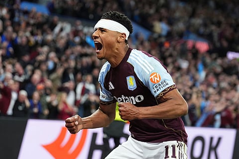 Aston Villa's Ollie Watkins celebrates scoring their first goal of the game during the Europa League second-leg semifinal soccer match between Aston Villa and Nottingham in Birmingham, England.