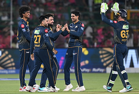 Gujarat Titans' Rashid Khan celebrates with teammates the wicket of Rajasthan Royals' Donovan Ferreira during the Indian Premier League cricket match between Rajasthan Royals and Gujarat Titans in Jaipur.