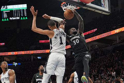 Minnesota Timberwolves forward Julius Randle (30) scores over San Antonio Spurs forward Victor Wembanyama (1) during the first half of Game 3 of a NBA basketball second-round playoff series in Minneapolis.