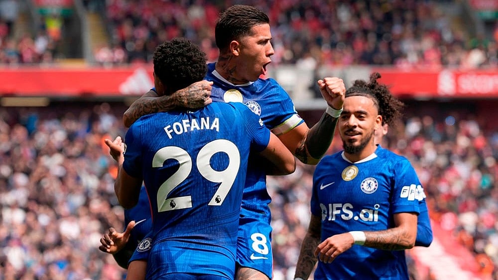 Chelsea's Enzo Fernandez (top) celebrates with team-mate Wesley Fofana after scoring their side's first goal of the game during the Premier League soccer match between Liverpool and Chelsea in Liverpool, England. - | Photo: Peter Byrne/PA via AP