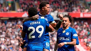 | Photo: Peter Byrne/PA via AP : Chelsea's Enzo Fernandez (top) celebrates with team-mate Wesley Fofana after scoring their side's first goal of the game during the Premier League soccer match between Liverpool and Chelsea in Liverpool, England.