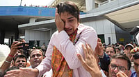Vinesh Phogat Vs WFI: Wrestler Indicates She Will Fight Back After Federation Issues Show Cause Notice PTI/Ravi Choudhary : File photo of wrestler Vinesh Phogat getting emotional as she arrives after her Paris Olympics heartbreak, at the IGI airport in New Delhi.