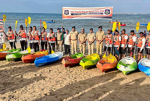 Gujarat Additional Director General of Police (ADGP) Amit Kumar Vishwakarma, center, and other police officials pose for photographs with athletes during the Intercoastal District Games 2026, in Gujarat. 