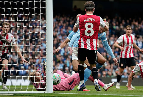 Manchester City's Erling Haaland scores his side's second goal during the English Premier League soccer match between Manchester City and Brentford in Manchester.