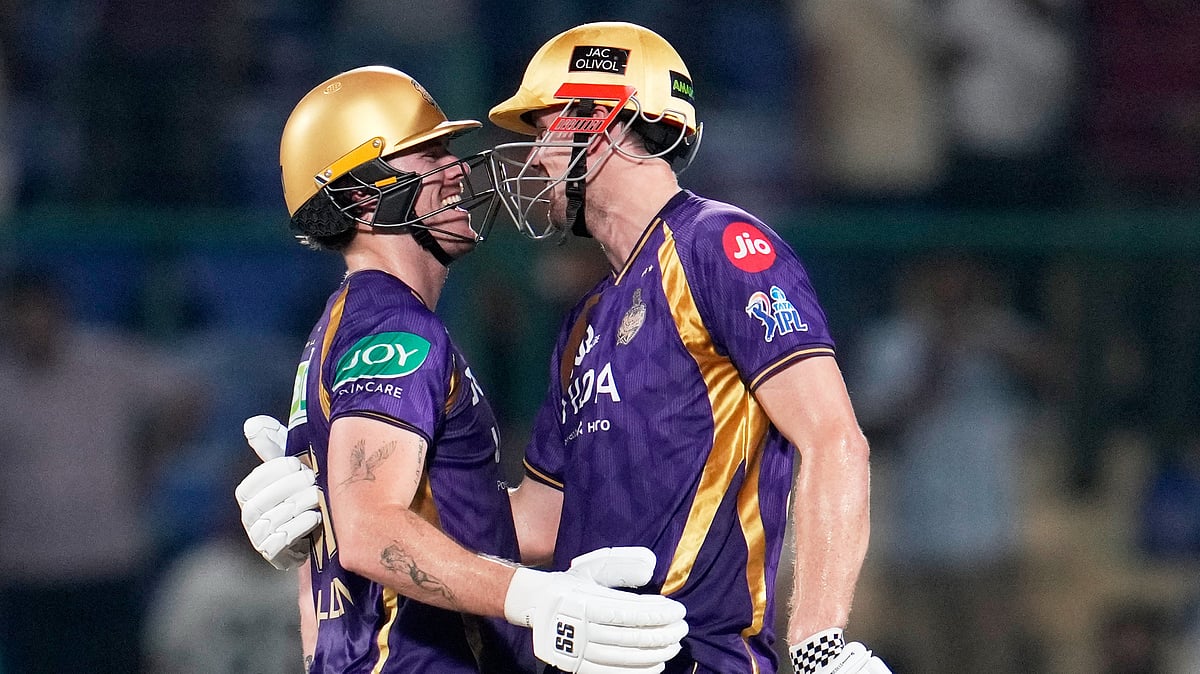 Kolkata Knight Riders' Finn Allen, left, is congratulated by teammate Cameron Green for completing his century during their Indian Premier League cricket match against Delhi Capitals in New Delhi, India, Friday, May 8, 2026. - (AP Photo/Manish Swarup)