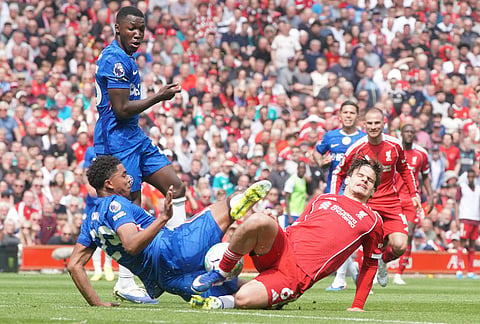 Chelsea's Wesley Fofana, left, and Liverpool's Milos Kerkez fight for the ball during the Premier League soccer match between Liverpool and Chelsea in Liverpool, England.