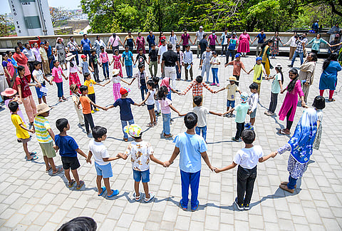 People experience 'Zero Shadow Day', a biannual celestial phenomenon, at Birla Planetarium, in Hyderabad, Telangana.