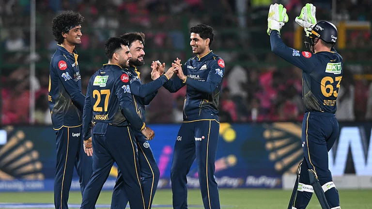 Gujarat Titans' Rashid Khan celebrates with teammates the wicket of Rajasthan Royals' Donovan Ferreira during the Indian Premier League cricket match between Rajasthan Royals and Gujarat Titans in Jaipur. - AP Photo