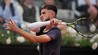 Novak Djokovic Vs Dino Prizmic, Italian Open 2026: 20-Year-Old Croatian Stuns Serbian Legend (AP Photo/Andrew Medichini) : Croatia's Dino Prizmic returns the ball to Serbia's Novak Djokovic during their match at the Italian Open tennis tournament, in Rome, Friday, May 8, 2026.