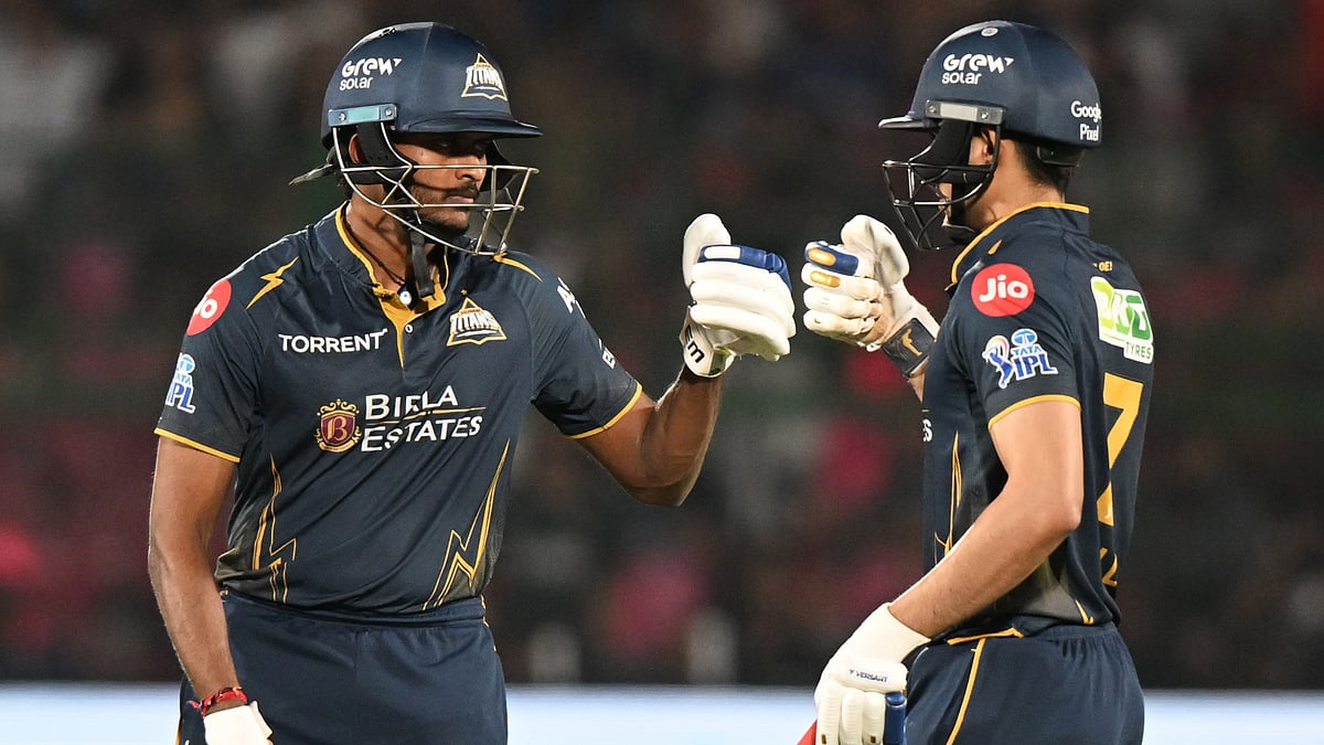 Gujarat Titans' Sai Sudharsan, left, tosses with Shubman Gill during the Indian Premier League cricket match between Rajasthan Royals and Gujarat Titans in Jaipur, India, Saturday, May 9, 2026 - (AP Photo/ Str)
