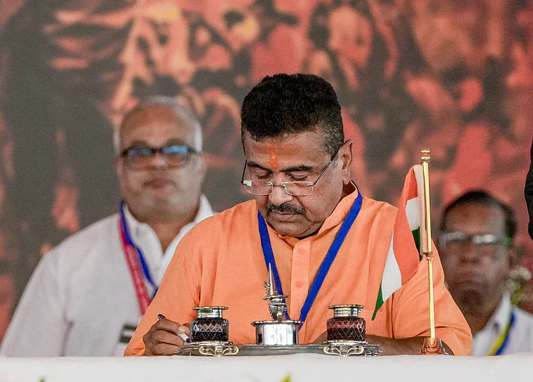 Kolkata: West Bengal chief minister-elect Suvendu Adhikari signs documents during his swearing-in ceremony as BJP forms government in the state for the first time, at Brigade Parade Ground in Kolkata, West Bengal, Saturday, May 9, 2026.
- (PTI Photo/Manvender Vashist Lav)