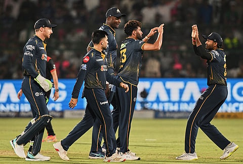 Gujarat Titans' Mohammed Siraj, centre, celebrate with teammates the wicket of Rajasthan Royals' Vaibhav Sooryavanshi during the Indian Premier League cricket match between Rajasthan Royals and Gujarat Titans in Jaipur.