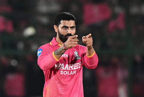 Rajasthan Royals' Ravindra Jadeja celebrates the wicket of Gujarat Titans' Jos Buttler during the Indian Premier League cricket match between Rajasthan Royals and Gujarat Titans in Jaipur.