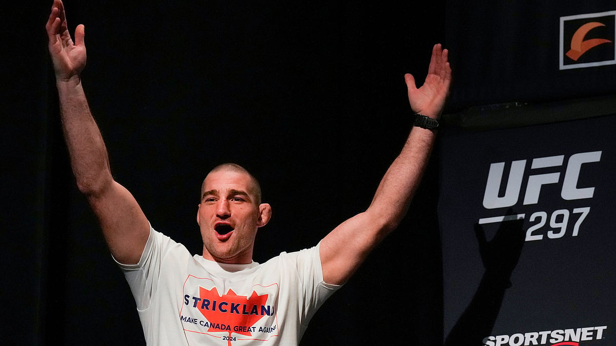  Sean Strickland, UFC middleweight champion, arrives on stage to face off with Dricus Du Plessis during a mixed martial arts news conference ahead of UFC 297 in Toronto. - AP Photo