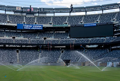 | Photo: AP/Yuki Iwamura : Sprinkler water grass during the pitch installation for FIFA World Cup 2026 at NYNJ Stadium in East Rutherford, New Jersey.