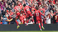 AP/Ian Hodgson : Liverpool platers celebrate after scoring during the Premier League soccer match between Liverpool and Chelsea in Liverpool, England.