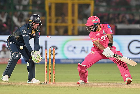Rajasthan Royals' Dhruv Jurel bowled out by Gujarat Titans' Rashid Khan during the Indian Premier League cricket match between Rajasthan Royals and Gujarat Titans in Jaipur.