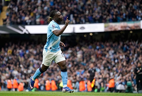 Manchester City's Jeremy Doku celebrates after scoring the opening goal during the English Premier League soccer match between Manchester City and Brentford in Manchester.