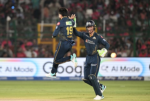 Gujarat Titans' Rashid Khan celebrates the wicket of Rajasthan Royals' Dhruv Jurel during the Indian Premier League cricket match between Rajasthan Royals and Gujarat Titans in Jaipur.