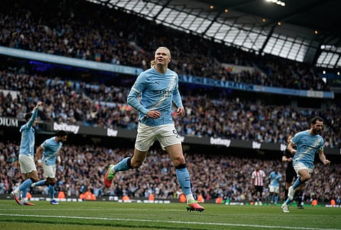 Manchester City's Erling Haaland celebrates after scoring his side's opening goal during the English Premier League soccer match between Manchester City and Brentford in Manchester.