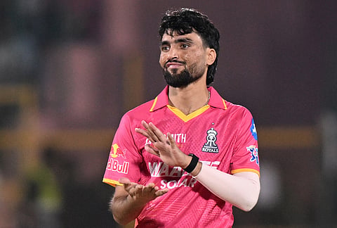 Rajasthan Royals' Brijesh Sharma celebrates the wicket of Gujarat Titans' Jason Holder during the Indian Premier League cricket match between Rajasthan Royals and Gujarat Titans in Jaipur.