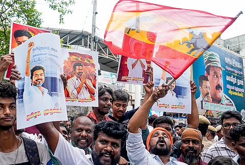 Tamilaga Vettri Kazhagam (TVK) and Viduthalai Chiruthaigal Katchi (VCK) supporters outside VCK party headquarters as party Treasurer SS Balaji and spokesperson KK Pavalan address a press conference on the official stand on supporting Vijay's TVK in forming the government in Tamil Nadu, in Chennai.