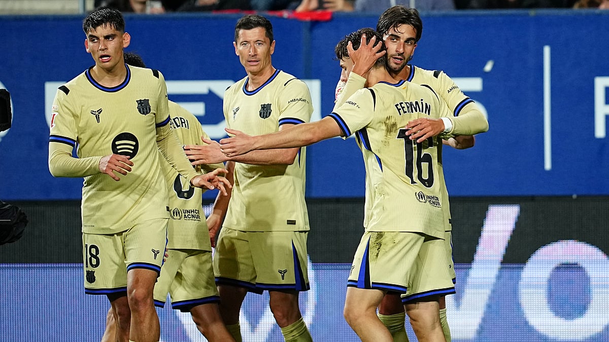 Barcelona's Ferran Torres, right, celebrates after scoring his side's second goal during a Spanish La Liga soccer match between Osasuna and Barcelona in Pamplona, Spain.  - AP Photo