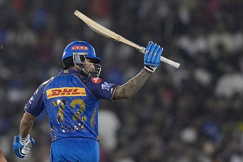 Mumbai Indians' Tilak Varma celebrates his fifty runs during the Indian Premier League cricket match between Royal Challengers Bengaluru and Mumbai Indians in Raipur, India.
