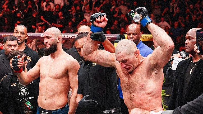 Sean Strickland (right) reacts after beating Khamzat Chimaev. - UFC