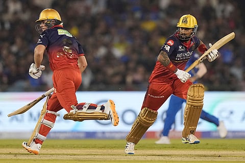 Royal Challengers Bengaluru's Krunal Pandya, right, and Jacob Bethell run between the wickets during the Indian Premier League cricket match between Royal Challengers Bengaluru and Mumbai Indians in Raipur, India.