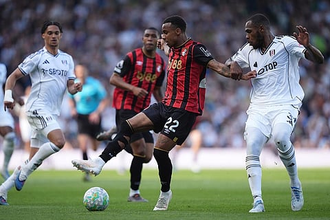 Bournemouth's Eli Junior Kroupi and Fulham's Issa Diop, right, during the English Premier League soccer match between Fulham and AFC Bournemouth in London.