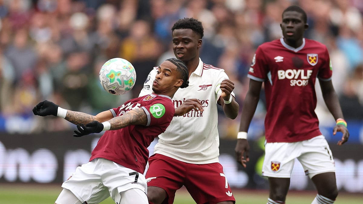 West Ham's Crysencio Summerville receives the ball in front of Arsenal's Bukayo Saka during the Premier League soccer match between West Ham and Arsenal in London. - AP Photo