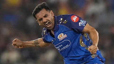 Deepak Chahar celebrates the wicket of Devdutt Padikkal during the Indian Premier League match between Royal Challengers Bengaluru and Mumbai Indians in Raipur.