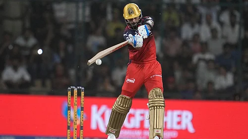 Photo: AP/Manish Swarup : Virat Kohli plays a shot during the Indian Premier League match between Delhi Capitals and Royal Challengers Bengaluru in Delhi.