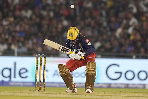 Royal Challengers Bengaluru's captain Rajat Patidar ducks a bouncer during the Indian Premier League cricket match between Royal Challengers Bengaluru and Mumbai Indians in Raipur, India.