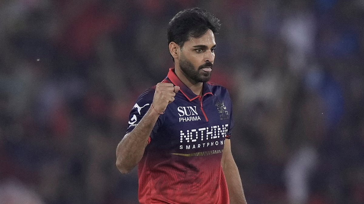 Royal Challengers Bengaluru's Bhuvneshwar Kumar celebrates the wicket of Mumbai Indians' Ryan Rickelton during the Indian Premier League cricket match between Royal Challengers Bengaluru and Mumbai Indians in Raipur, India, Sunday, May 10, 2026.  - AP Photo/Mahesh Kumar A.
