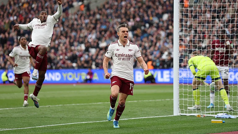 Arsenal's Leandro Trossard celebrates after scoring during the Premier League soccer match between West Ham and Arsenal in London. - AP Photo