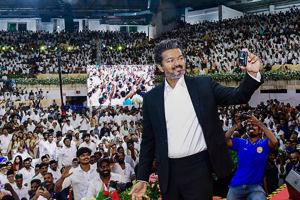 Newly-elected Tamil Nadu Chief Minister and Tamilaga Vettri Kazhagam (TVK) chief C Joseph Vijay takes a selfie with the gathering during his swearing-in ceremony, at Jawaharlal Nehru Stadium, in Chennai - Photo: PTI 