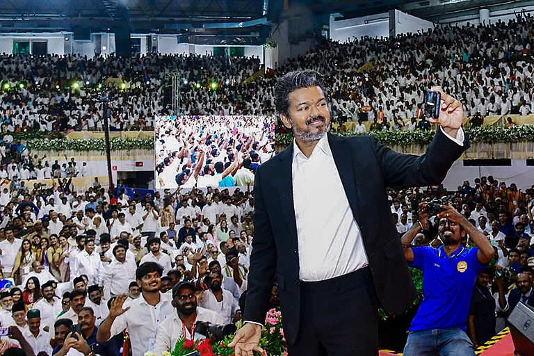 Newly-elected Tamil Nadu Chief Minister and Tamilaga Vettri Kazhagam (TVK) chief C Joseph Vijay takes a selfie with the gathering during his swearing-in ceremony, at Jawaharlal Nehru Stadium, in Chennai - Photo: PTI
