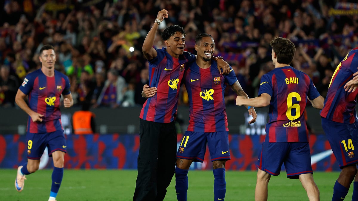 Barcelona's Lamine Yamal and Raphinha Barcelona celebrate after winning the Spanish La Liga El Clasico between FC Barcelona and Real Madrid that makes them Spanish league champions in Barcelona,. - AP Photo