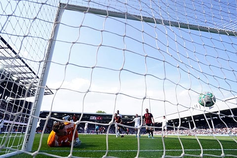 Bournemouth's Marcus Tavernier, center, celebrates as teammate Rayan, not pictured, scores their side's first goal English Premier League soccer match between Fulham and AFC Bournemouth in London.