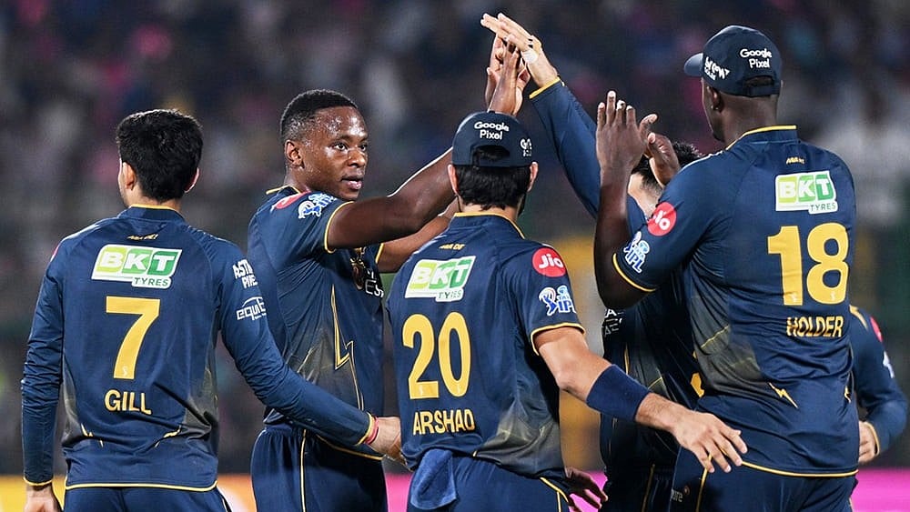 Gujarat Titans' Kagiso Rabada, centre, celebrate with teammates the wicket of Rajasthan Royals' Shimron Hetmyer during the Indian Premier League cricket match between Rajasthan Royals and Gujarat Titans in Jaipur. - | Photo: AP