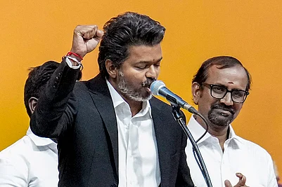 Photo: PTI/R Senthilkumar : Tamilaga Vettri Kazhagam (TVK) chief C Joseph Vijay takes oath as the Tamil Nadu Chief Minister during the swearing-in ceremony, at Jawaharlal Nehru Stadium, in Chennai.