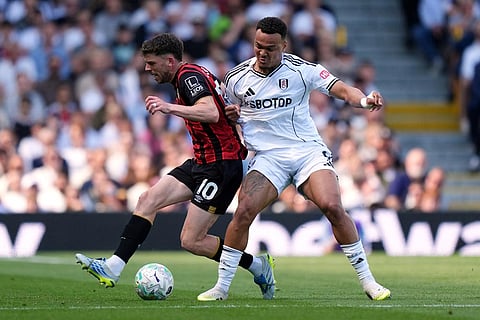 Bournemouth's Ryan Christie, left, and Fulham's Rodrigo Muniz battle for the ball during the English Premier League soccer match between Fulham and AFC Bournemouth in London.