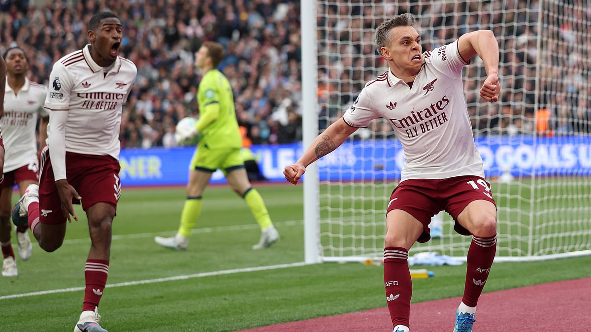 Arsenal's Leandro Trossard celebrates after scoring during the Premier League soccer match between West Ham and Arsenal in London. - AP Photo