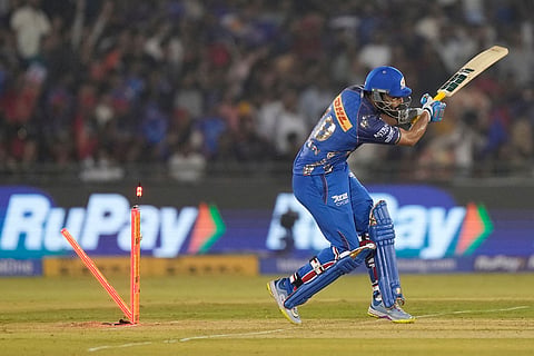 Mumbai Indians' Naman Dhir bowled out by Royal Challengers Bengaluru's Rasikh Dar during the Indian Premier League cricket match between Royal Challengers Bengaluru and Mumbai Indians in Raipur, India.